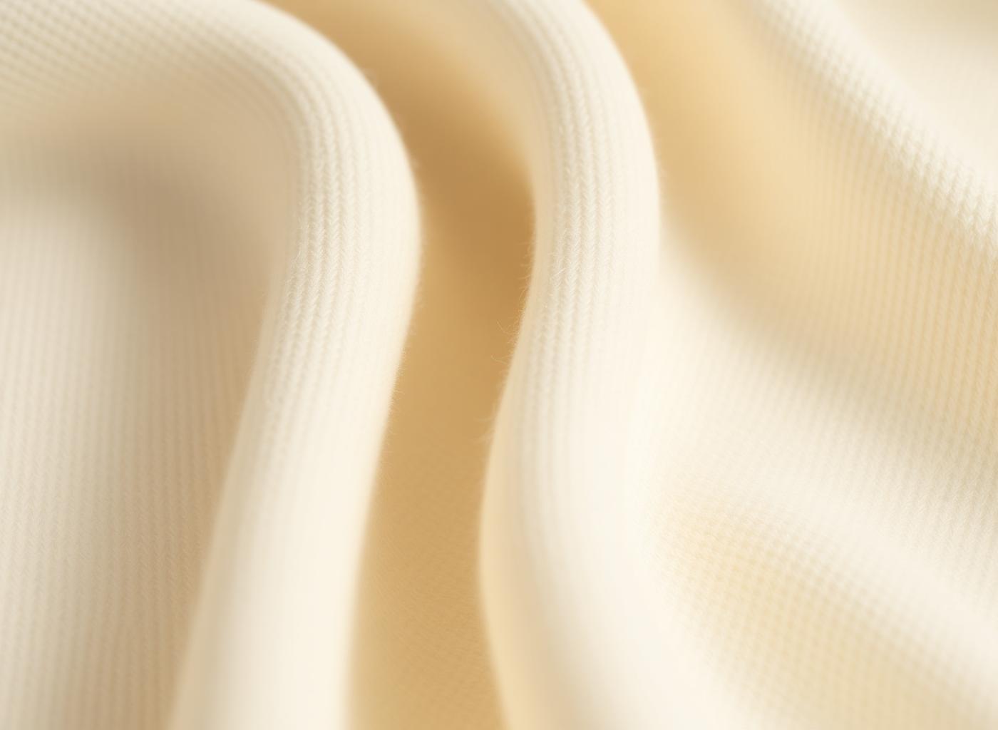 Macro close-up of heavyweight cream cotton fleece